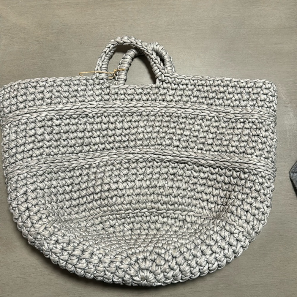 Gray chunky nylon crocheted tote bag.